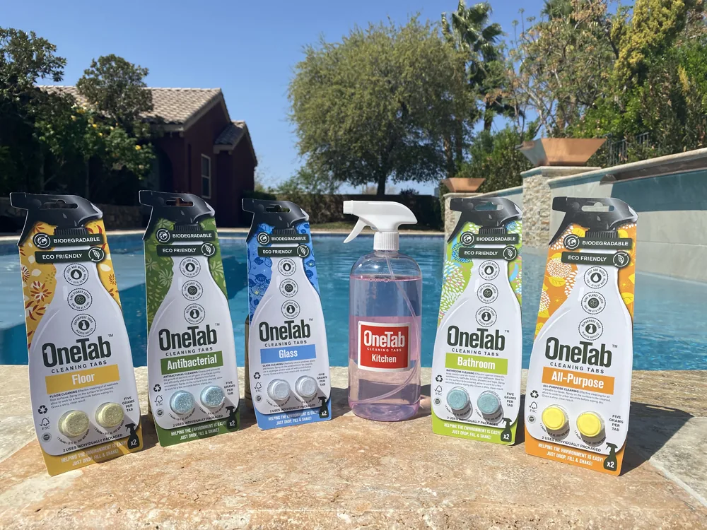 The full OneTab cleaning tablet lineup: floor, antibacterial, glass, bathroom, kitchen, and all purpose, with a refilled spray bottle, poolside